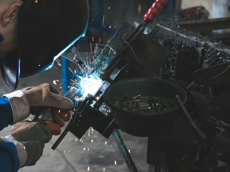 Technician working among large industrial machinery