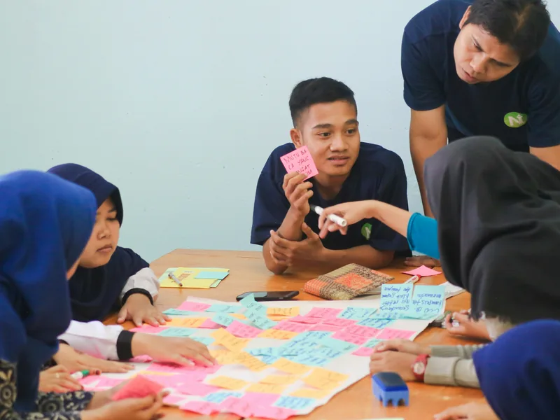technology team sharing ideas in a workshop